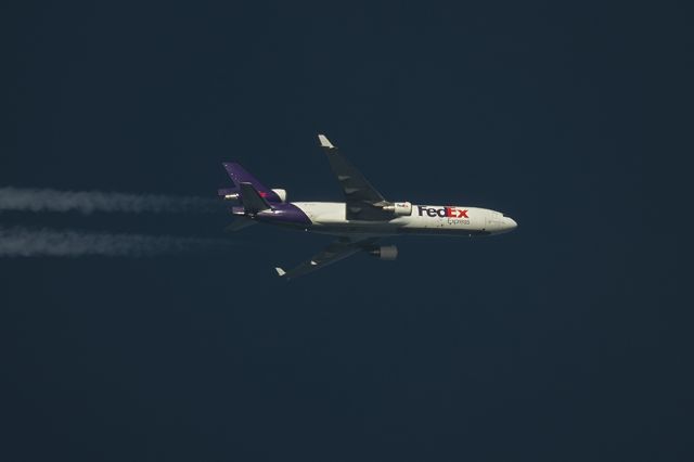 Boeing MD-11 (N578FE) - 25th March 2017 Fedex MD-11F N578FE Passes overhead Lancashire, United Kingdom at 33,000ft working route MEM-CDG. Photo taken from the ground using telescope & Pentax K-5 DSLR.