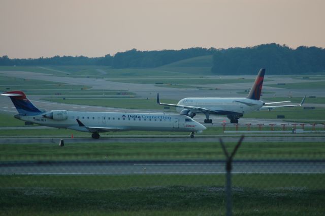 Canadair Regional Jet CRJ-700 (N371CA) - CRJ just landed with a 767 taxing onto 27