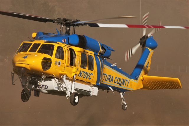 Sikorsky S-70 (N70VC) - A Ventura County Sheriff S-70A Firehawk, converted from a former United States Army HH-60L Blackhawk, kicks up a dust storm while departing from Hansen Dam during the 2021 American Heroes Airshow. 