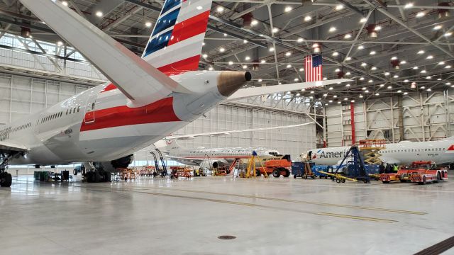 — — - AA's beautiful new state-of-the-art hanger at ORD. 