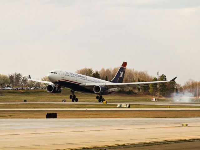 Airbus A330-200 (N280AY) - A smooth landing at Charlotte, North Carolina USA at about 16:50 on Sunday, 13 March 11. This long range US Airways Airbus A330-200 seems to do a long, ballerina style tippy-toe past probably one of the best public viewing areas at any US airport. Hi yaall! Inbound as Rome, Italy flight AWE 721, it will be going out later as AWE 786 to Paris, France (CDG).