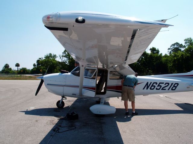 Cessna Skyhawk (N65218) - May 25, 2006 -- My son getting this plane ready to take me (his Mom) on my first right seat solo ride with him!!!