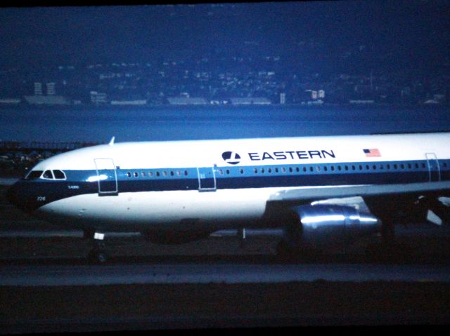 N226EA — - San Francisco KSFO - Eastern Airlines A300B4 landing 28R in this late 1970s or early 80s photo. 1000mm lens shot on color slide film.