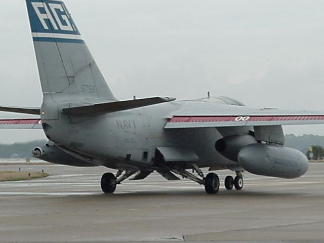 — — - This modified S3 is used to shuttle cargo from airbases and Carriers using the cargo pod on right wing