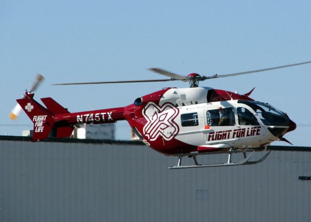 KAWASAKI EC-145 (N745TX) - Departing Downtown Shreveport.