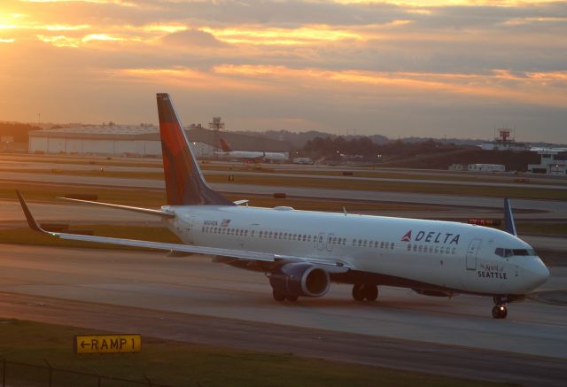 Boeing 737-900 (N809DN) - Spirit of Seattle taxiing by on a very early, freezing cold morning.