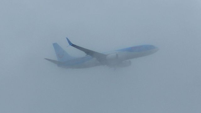 Boeing 737-800 (G-FDZE) - View from garden, trying out my first Tele lens(Sony 75-300mm). Plane is on approach at about 3000ft, passing through some low cloud. I cropped this and adjusted lighting a bit. Any tips would be appreciated.  