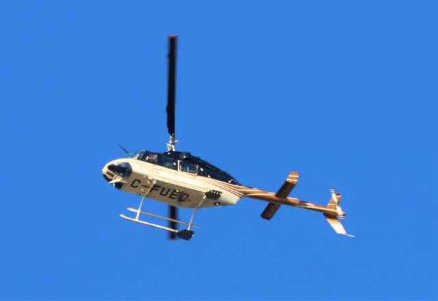 Bell JetRanger (C-FUEQ) - C-FUEQ Bell 206-4 Donahue Forest Products Inc. survolant la ville de Lavaltrie QC. le 12-12-2022 à 09:15