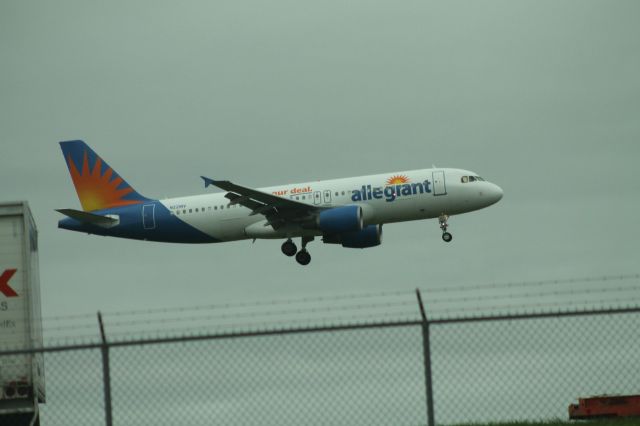 Airbus A320 (N221NV) - Allegiant Air flight 982 from KPGD arriving on runway 06.