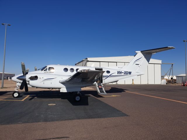 Beechcraft Super King Air 200 (VH-XDW) - VH-XDW in front of Helicopter Hangar at Moomba