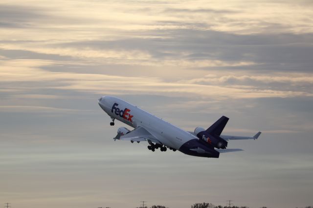 Boeing MD-11 (N594FE) - Wonderful clouds as this MD-11 blasts off.