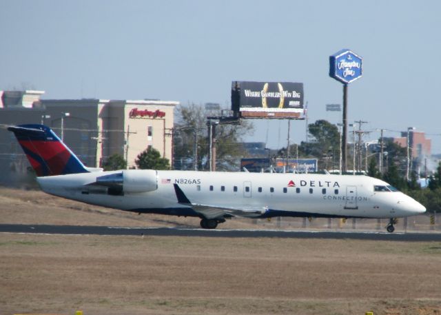 Canadair Regional Jet CRJ-200 (N826AS) - Taking off from the Shreveport Regional airport.