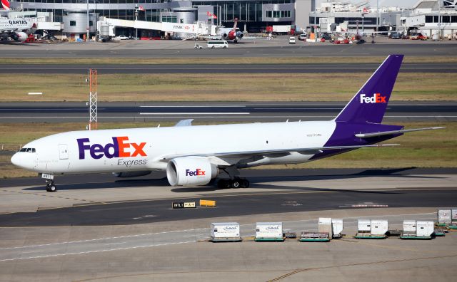 BOEING 777-200LR (N897FD) - Taxiing to the freight ramp