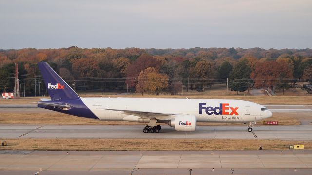 BOEING 777-200LR (N868FD) - "Jospeh" taxis after arrival on 18R.