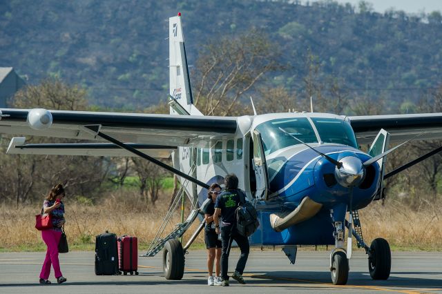 Cessna Caravan (ZS-JAX) - This Cessna C208 Caravan collecting visitors at Malelane Airfield after their visit to the Kruger National Park.