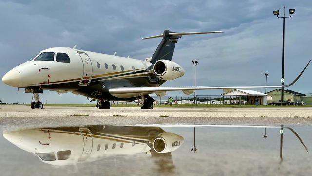 Embraer Legacy 450 (N405FX) - Legacy 450 doing some ‘reflecting’ on life lol. br /br /N405FX resting on the ramp after being diverted from Gary/Chi Intl’ several hours earlier. 8/3/22. 