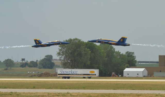 McDonnell Douglas FA-18 Hornet — - US Navy Blue Angels Solo Pilots conducting a center point crossing at 800mph closure rate during the Power on the Prairie Airshow - 2012 in Sioux Falls SD