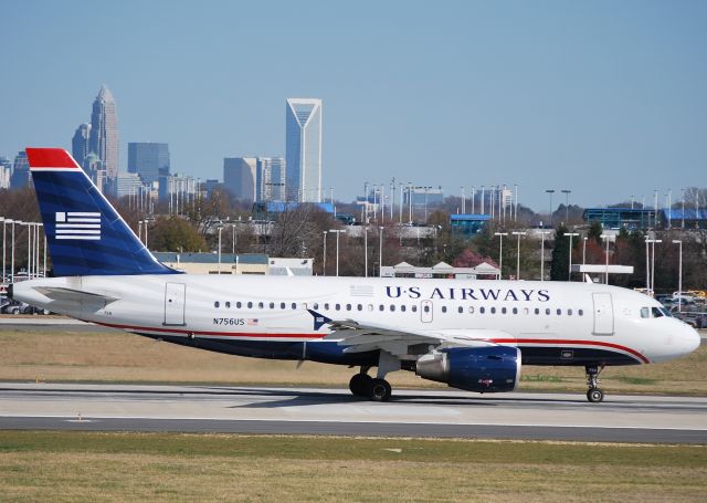 Airbus A319 (N756US) - Take-off roll 18C - 2/28/12