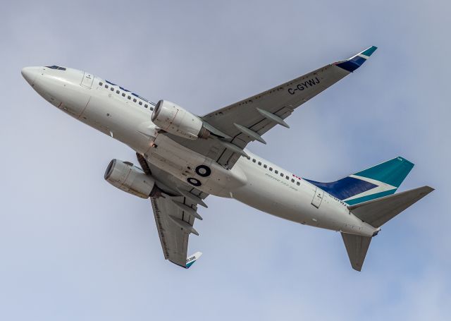 Boeing 737-700 (C-GYWJ) - One of many Canadian jets heading to Fort Lauderdale this morning. Westjet 1232 climbs off runway 24R…br /Feb. 18th 2018 10:30am