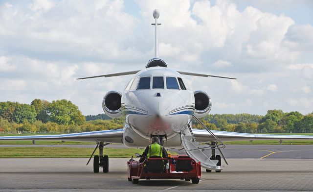 VP-BPW — - Falcon 900EX about to be towed into hangar - Nikon 810 70-200 2.8