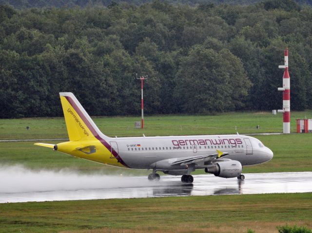 Airbus A319 (D-AKNT) - Drying the wet runway