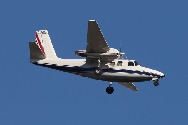 Aero Commander 500 (VH-YJO) - Shrike Commander on approach to YMYB on the daily run.