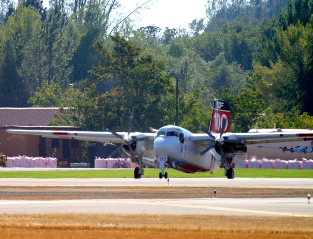 MARSH Turbo Tracker (N441DF) - KRDD - Tanker 100 rolling to the main loaded with Phos-chek - click full picture and look in the background, you can see the bags of ready-mix Phos-chek in the bags sitting on the ground ready to be added to the big tanks behind the S2-T.