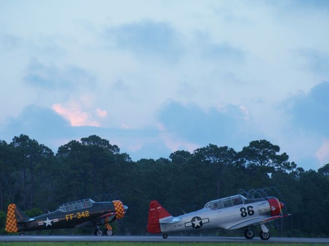 N7061C — - T-6s departing DTS on a rainy evening.