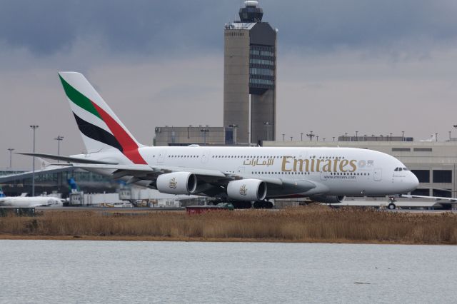 Airbus A380-800 (A6-EUT) - Emirates A380 arriving to BOS with the Logan's airport tower in back on 1/20/22. 