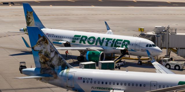 Airbus A320neo (N337FR) - Frontier Airlines A320 neo "Hunter the Bobcat" and A321 "Virginia the Wolf" parked at Terminal 3 at PHX on 8/28/22. Stitched together 13000x6500 pixel image. Taken with a Canon 850D and Rokinon 135mm f/2 manual focus lens.