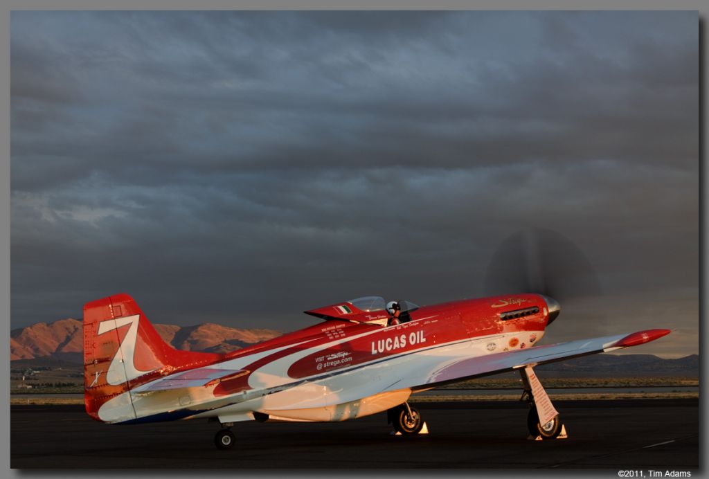 — — - Steve Hinton Jr. in Strega heading out for a morning test flight.