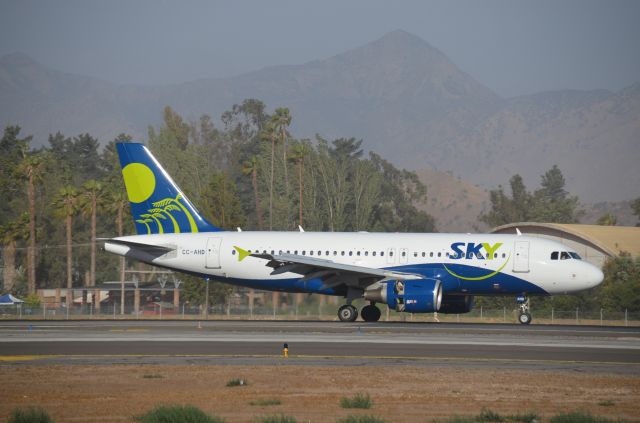 Airbus A319 (CC-AHD) - Brand new to Chile, is Sky Airlines.  This one is seen rolling out after landing in Santiago in December of 2013.