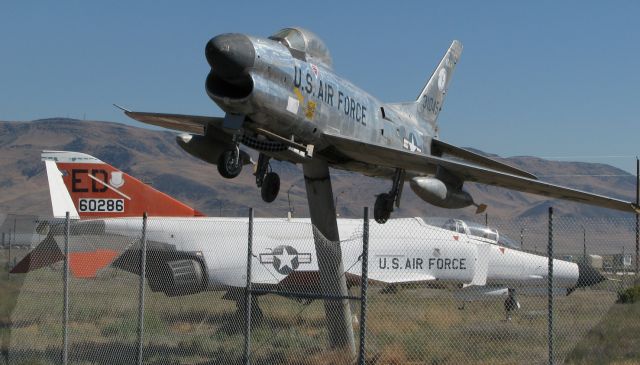 North American F-86 Sabre (53-1045) - This photo, the first-ever FA gallery picture from KBAM (Battle Mountain, Nevada) airport to be posted into the FA gallery, was taken nine years ago (in August, 2008).  It shows a North American F-86L Sabre (53-1045) and, in the background, a McDonnell Douglas F-4E Phantom (66-0286).  In the nine years since this pic was clicked, both of these old warbirds have been removed from KBAM.