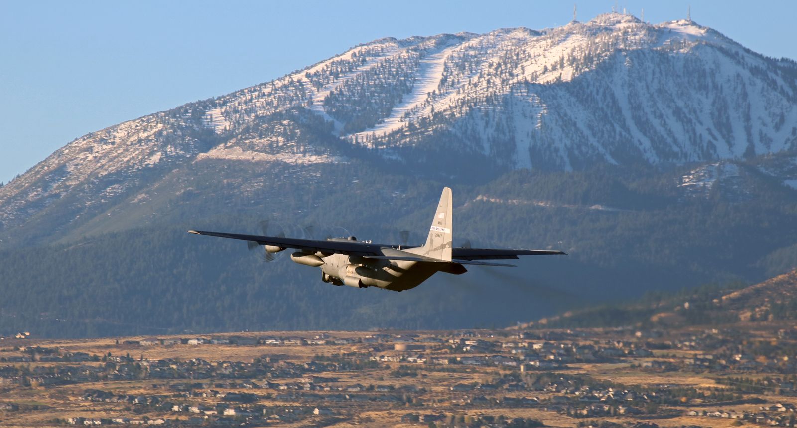 Lockheed C-130 Hercules (92-0547) - A Nevada Air Guard (152nd AW) "High Rollers" C-130H (92-0547) is caught as it climbs away from KRNOs 16R while making an early morning departure from Reno enroute to Mountain Home AFB (KMUO) in Idaho.