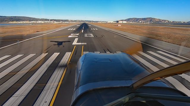 STINSON V-76 Sentinel (N63355) - Seconds to touchdown on 28L at SFO, in a 73-year-old Stinson L-5/G ambulance. 