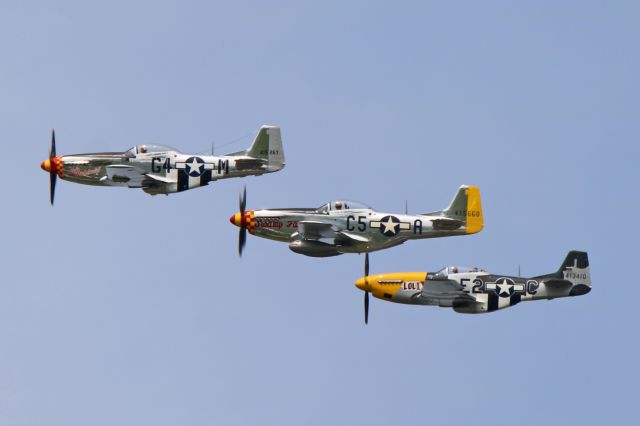 North American P-51 Mustang (N5240V) - Swamp Fox (N5420V), between Aint Misbehavin (N51KB) and Lou IV (N51TK), approaching the National Museum of the US Air Force as part of the Memphis Belle celebration on 17 May 2018.