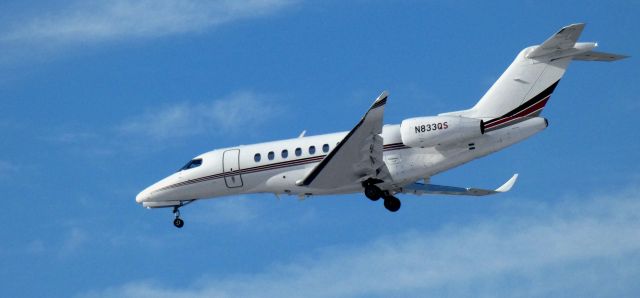 Cessna Citation Longitude (N833QS) - About to touch down is this 2022 Cessna 700 Citation Longitude in the Winter of 2025.