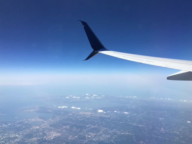 Boeing 737-900 (N869DN) - Flying over the Tampa area.