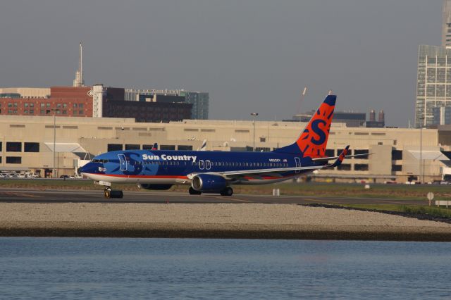 Boeing 737-800 (N823SY) - Sun Country departing Boston Logan with smallLake George sticker on front of plane.