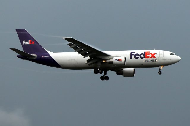Airbus A300F4-600 (N726FD) - FDX 3736 arriving from Indianapolis iwith a t-storm vapor trail