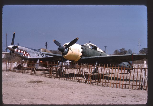 North American P-51 Mustang (N5441V) - Credit to Frank M.br /br /Uploaded with the okay from Robert Patterson.br /br /Taken sometime in the 60s (From what I was told)br /br /With A6M5 Zero - NX46770