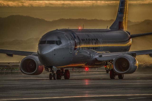 Boeing 737-700 — - American Airlines taxing down Alpha for a 10R departure during a recent storm here at KSFO, shot from the ramp