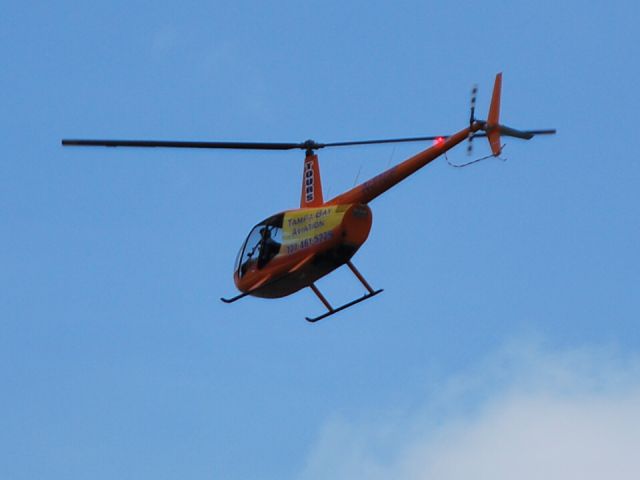 Robinson R-44 (N31UP) - CLEARWATER HELICOPTERS INC flying along the beach at Treasure Island, FL - 7/27/14 