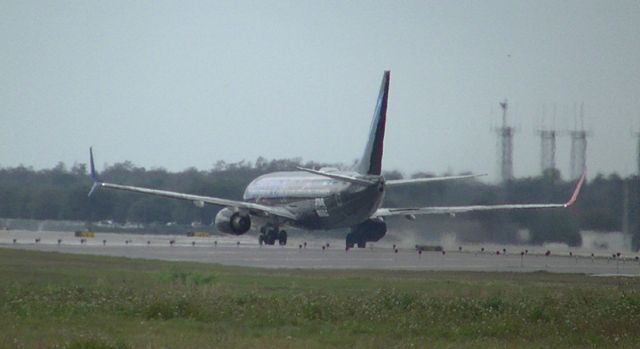 Boeing 737-800 (N36272) - SKYWALKER starts takeoff roll at Orlando Runway 17R.