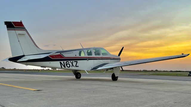 Beechcraft Bonanza (36) (N6XZ) - A Bonanza on the ramp at Kentland Municipal in the closing minutes of the sunset. br /br /This aircraft is a 1982 Beechcraft A36 Bonanza, SN E-2047, owned by Kahler Automation Corp. 10/13/22. 