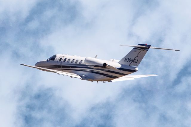 Cessna Citation CJ1 (N309CJ) - N309CJ is a 2006 Cessna 525A CJ2. The aircraft had just taken off from Atlanta's PDK executive airport and the gear doors closed when I got this shot. This CJ2 wan enroute to Palm Beach International airport KPBI. I shot this with a Canon 5DSR and a Canon 500mm F4 IS lens with a 1.4x extender on it making the focal length 700mm. Camera settings were 1/8000 shutter, F5.6, ISO 640. Please check out my other aviation photography. Votes and positive comments are always appreciated. Questions about this photo can be sent to Info@FlewShots.com