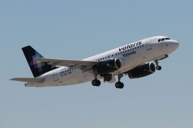 Airbus A319 (XA-VOJ) - As my 100th submission to FAs photo gallery, I picked an aircraft that is not already featured in the gallery.  This is my first catch of a Volaris Airlines a/c and it occurred during my first visit to Norman Y. Mineta Airport (San Jose International).  (Note: The airline logo on the tail has not been edited or blurred; that is the actual logo design of Volaris.  I even did a double-take when I first saw it thru the viewfinder.   lol)