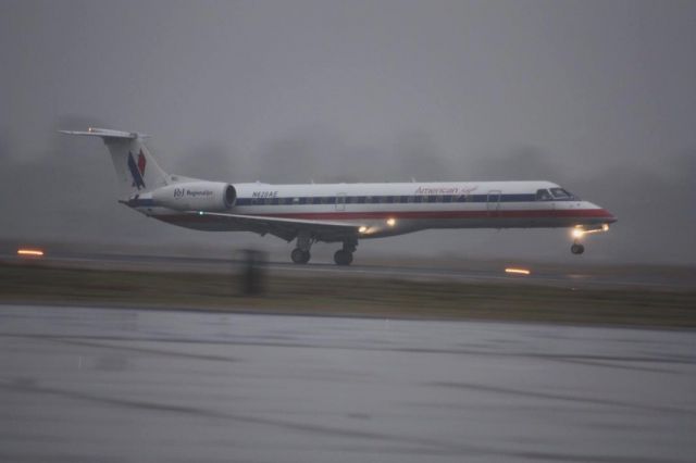 Embraer ERJ-145 (N620AE) - Landing during a snow shower in December 2010 on RNWY 36