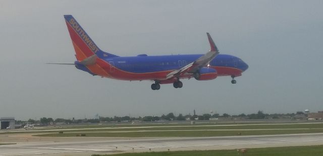 Boeing 737-700 (N8326F) - August 6, 2014 3:05PM landing on runway 4R.