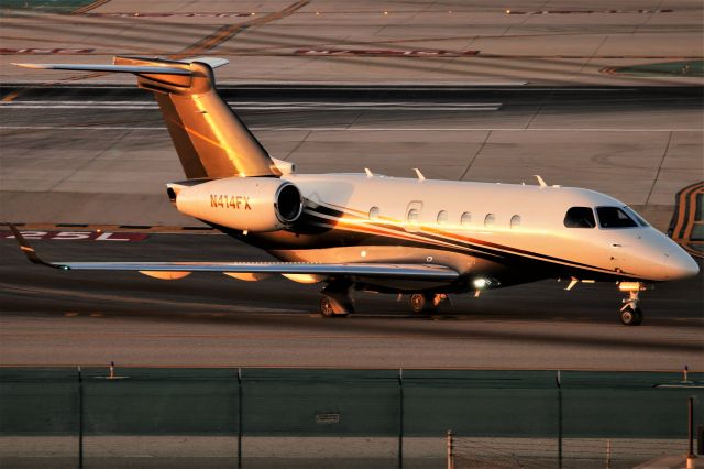 Embraer Legacy 450 (N414FX) - An EMB-545 Legacy 450 taxing to the Atlantic Aviation FBO during golden hour.